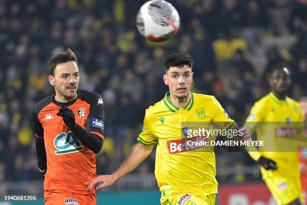 Nantes' French forward Matthis Abline fights for the ball with Laval's French portuguese defender Yohan Tavares during the French Cup round of 32...