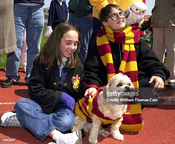 Marybeth Grasso , of Ocean City, New Jersey and her cousin Stacey Grasso , of Lower Merion, Pennsylvania, dressed as Harry Potter, watch the...