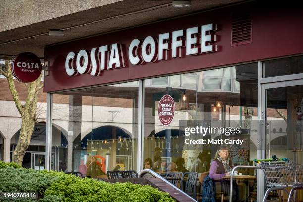 The sun shines on the Costa logo outside a branch of the coffeehouse chain Costa Coffee on January 16, 2024 in Nailsea, England. Costa Coffee...