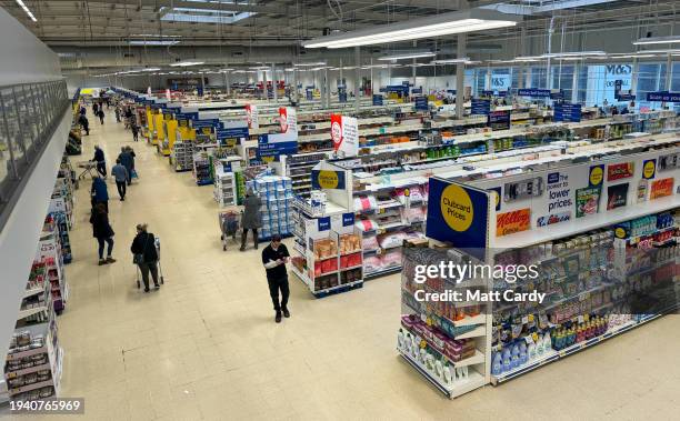 People shop inside a branch of the supermarket retailer Tesco on January 7, 2024 in Bristol, England. The British retailer, founded in 1919, is one...