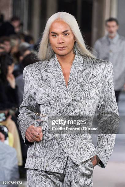 Sutan "Raja" Amrull walks the runway during the LGN Louis Gabriel Nouchi Menswear Fall/Winter 2024-2025 show as part of Paris Fashion Week on January...