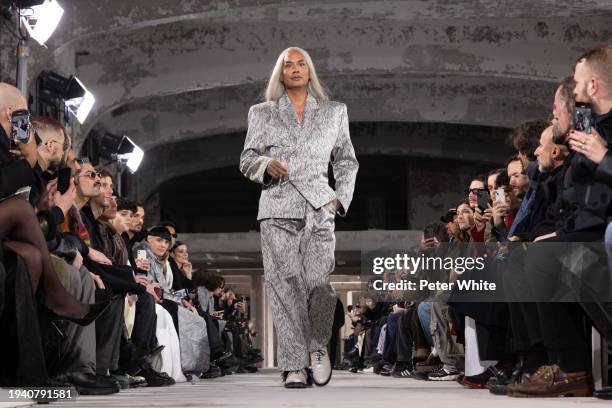 Sutan "Raja" Amrull walks the runway during the LGN Louis Gabriel Nouchi Menswear Fall/Winter 2024-2025 show as part of Paris Fashion Week on January...