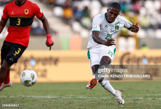 Mauritania's forward Sidi Bouna Amar kicks to score his team's first goal during the Africa Cup of Nations 2024 group D football match between...