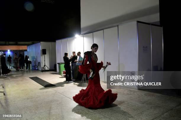 Model prepares backstage during the International Flamenco Fashion Week - SIMOF in Seville on January 20, 2024.