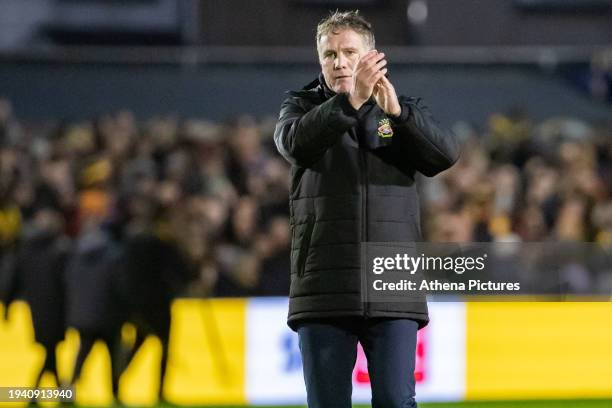 Phil Parkinson Manager of Wrexham applauds supporters of Wrexham during the Sky Bet League Two match between Newport County and Wrexham AFC at Rodney...
