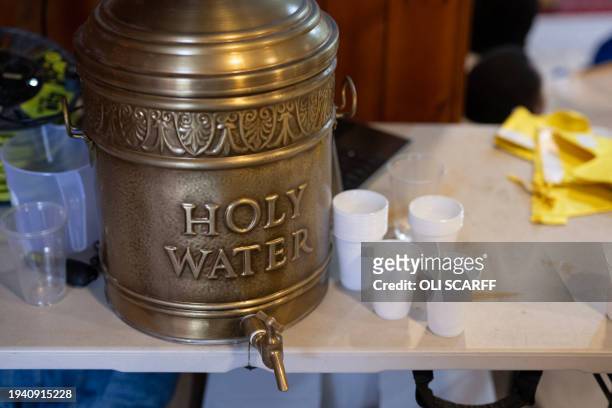 An urn holding holy water available during a service to celebrate Timket, or the feast of Epiphany, in the Eritrean Orthodox Tewahdo church in Leeds,...