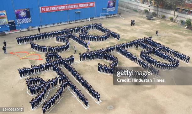 School students making human chain shown display "Jai Shri Ram" at Vidya Bal Bhawan Senior Secondary School, Mayur Vihar ahead of the Shri Ram temple...