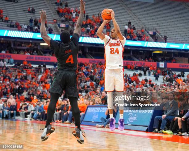 Syracuse Orange Guard Quadir Copeland shoots a three point shot over Miami Hurricanes Guard Bensley Joseph to win the game during the second half of...