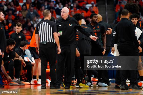 Miami Hurricanes Head Coach Jim Larranaga speaks with an official at a break during the first half of the College Basketball game between the Miami...