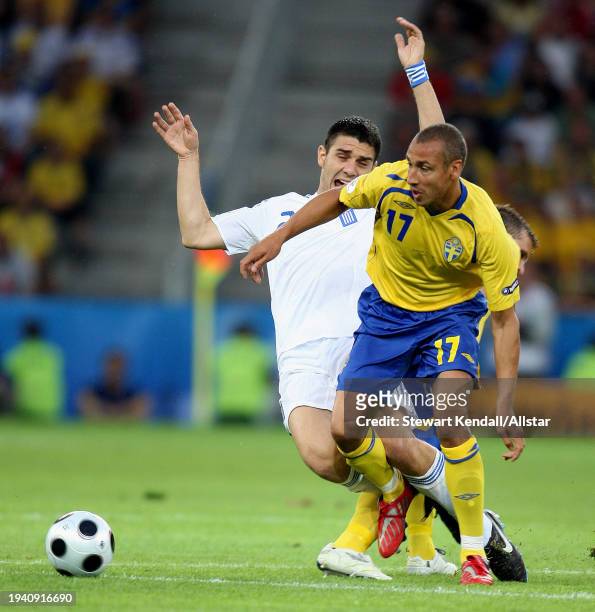 June 10: Koslas Katsouranis of Greece and Henrik Larsson of Sweden challenge during the UEFA Euro 2008 Group D match between Greece and Sweden at Em...