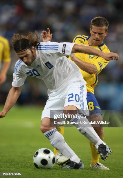 June 10: Giannis Amanatidis of Greece and Anders Svensson of Sweden challenge during the UEFA Euro 2008 Group D match between Greece and Sweden at Em...