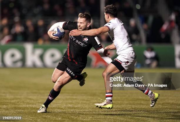 Saracens' Elliot Daly is tackled by Lyon's Liam Rimet during the Investec Champions Cup match at the StoneX Stadium, London. Picture date: Saturday...