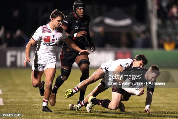 Saracens' Elliot Daly is tackled by Lyon's Liam Rimet during the Investec Champions Cup match at the StoneX Stadium, London. Picture date: Saturday...