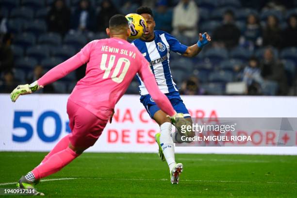 Porto's Brazilian defender Wendell scores his team's first goal in spite of Moreirense's Brazilian goalkeeper Kewin during the Portuguese League...