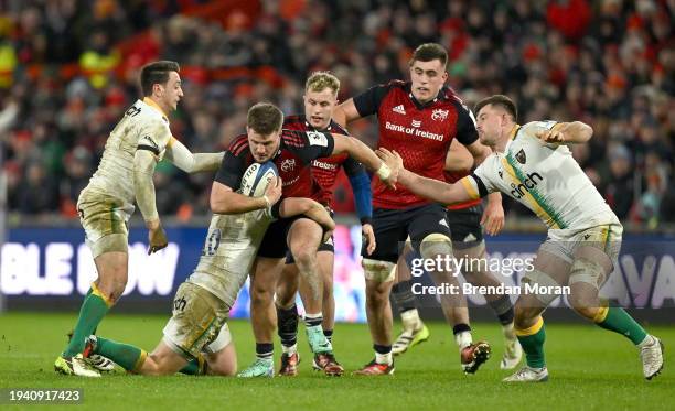 Limerick , Ireland - 20 January 2024; Alex Nankivell of Munster is tackled by Fin Smith of Northampton Saints during the Investec Champions Cup Pool...