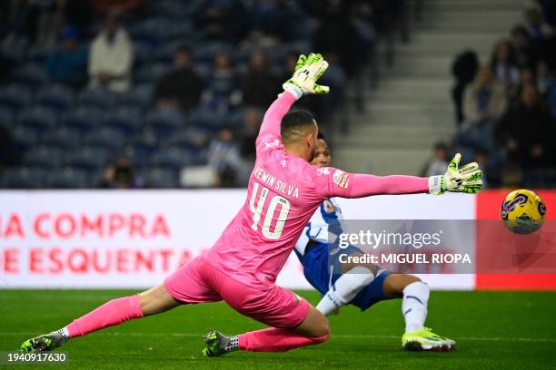 Porto's Brazilian defender Wendell scores his team's first goal in spite of Moreirense's Brazilian goalkeeper Kewin during the Portuguese League...