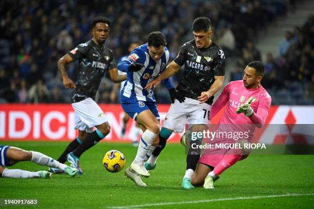 Porto's Brazilian forward Pepe vies with Moreirense's Portuguese defender Dinis Pinto during the Portuguese League football match between FC Porto...