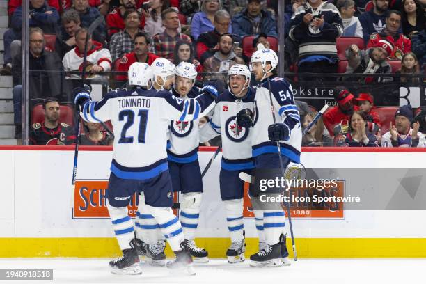 Winnipeg Jets Right Wing Mason Appleton celebrates his goal with Center Dominic Toninato , Left Wing Nino Niederreiter , Defenceman Nate Schmidt and...