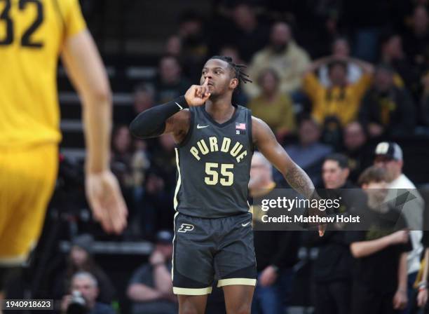 Guard Lance Jones of the Purdue Boilermakers gestures to silence the crowd after a three-point basket during the second half against the Iowa...