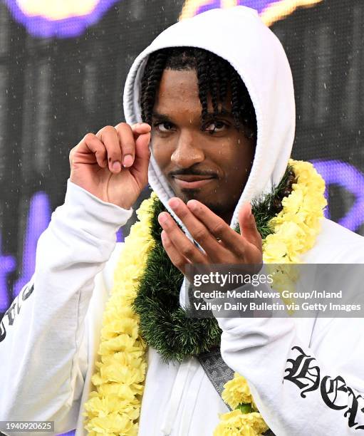 San Bernardino, CA Heisman Trophy winner and 2019 Cajon High School graduate Jayden Daniels acknowledges a friend in the crowd during a homecoming...