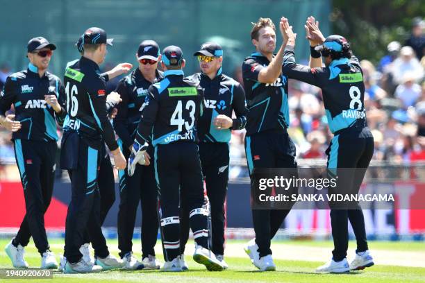 New Zealand's Tim Southee celebrates with teammates after taking the wicket of Pakistan's Haseebullah Khan during the fifth and final Twenty20...