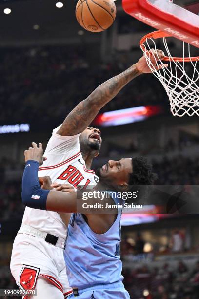 Andre Drummond of the Chicago Bulls misses on a dunk attempt over Jaren Jackson Jr. #13 of the Memphis Grizzlies in the first half on January 20,...