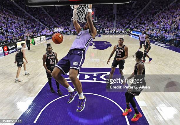 Will McNair Jr. #13 of the Kansas State Wildcats scores a basket with a dunk in the first half against the Oklahoma State Cowboys at Bramlage...