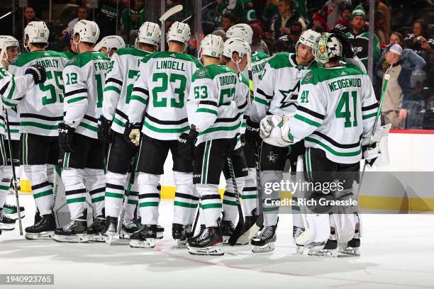 Scott Wedgewood of the Dallas Stars celebrates with teammates the win in the game against the New Jersey Devils at the Prudential Center on January...