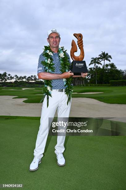 Steven Alker of New Zealand poses with the trophy dafter winning the PGA TOUR Champions Mitsubishi Electric Championship at Hualalai Golf Course on...