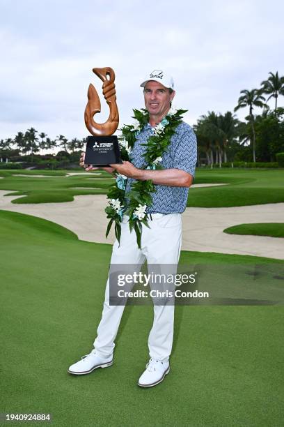 Steven Alker of New Zealand poses with the tournament trophy after winning the PGA TOUR Champions Mitsubishi Electric Championship at Hualalai Golf...