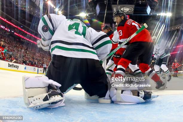 Scott Wedgewood of the Dallas Stars makes a save with Nico Hischier of the New Jersey Devils in front during the second period of the game at the...