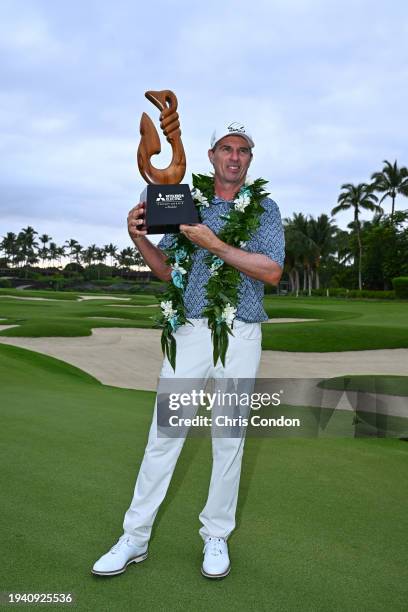 Steven Alker of New Zealand poses with the tournament trophy after winning the PGA TOUR Champions Mitsubishi Electric Championship at Hualalai Golf...