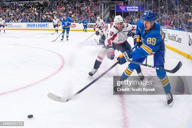 Pavel Buchnevich of the St. Louis Blues passes the puck as Martin Fehervary of the Washington Capitals defends on January 20, 2024 at the Enterprise...