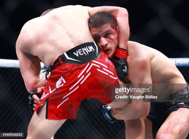 Arnold Allen of England fights against Movsar Evloev of Russia in a featherweight bout during the UFC 297 event at Scotiabank Arena on January 20,...