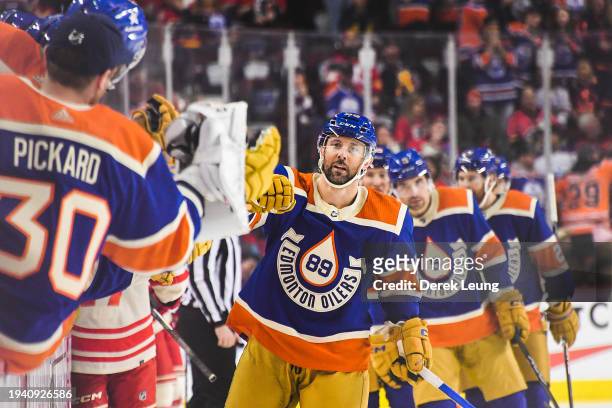 Sam Gagner of the Edmonton Oilers celebrates with the bench after scoring against the Calgary Flames during the third period of an NHL game at...