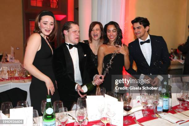 Maria Ehrich, Max von der Groeben, Lena Schoemann, Gizem Emre, Mido Kotaini with champagne during the 48th German Film Ball 2024 at Hotel Bayerischer...