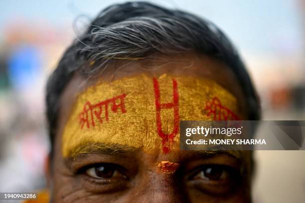 Devotee with his forehead marked with the name of Hindu god Ram looks on, in Ayodhya on January 21 on the eve of the consecration ceremony of a...