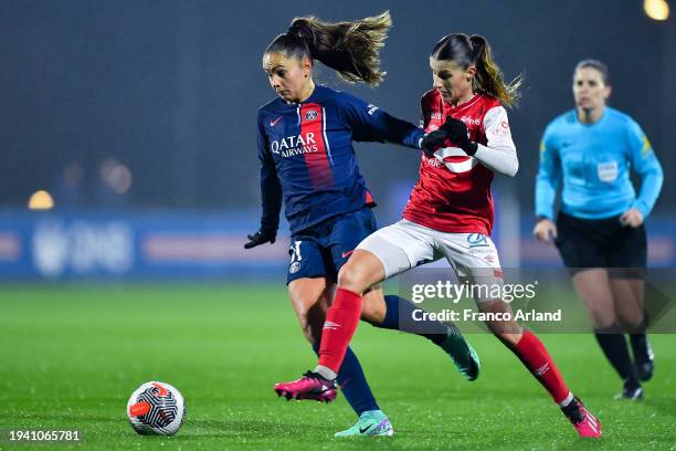 Lieke Martens of PSG runs with the ball under pressure from Julie Pasquereau of Stade de Reims during the D1 Arkema match between Paris Saint-Germain...