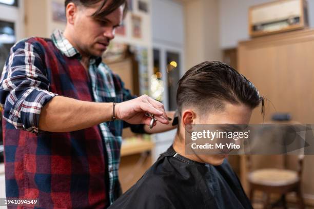 a teenager getting a haircut at the hairdresser's - early rock & roll stock pictures, royalty-free photos & images