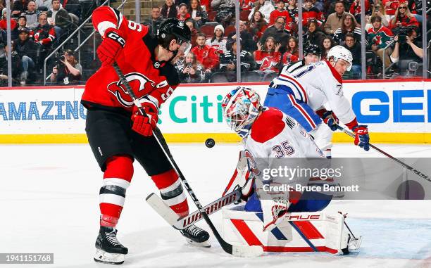 Erik Haula of the New Jersey Devils is stopped by Sam Montembeault of the Montreal Canadiens during the second period at Prudential Center on January...