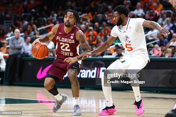 Darin Green Jr. #22 of the Florida State Seminoles drives against Wooga Poplar of the Miami Hurricanes during the second half of the game at Watsco...