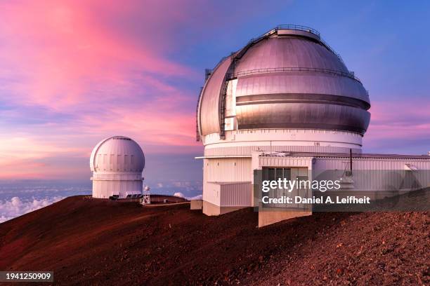 telescopes at mauna kea observatories at sunset in hawaii - observatory stock pictures, royalty-free photos & images