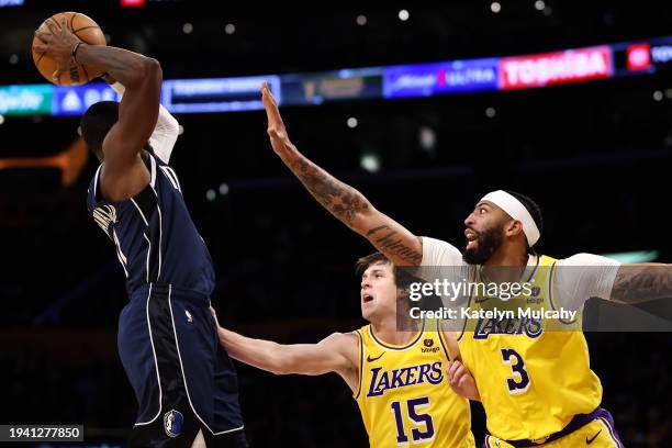 Tim Hardaway Jr. #10 of the Dallas Mavericks passes the ball against Austin Reaves and Anthony Davis of the Los Angeles Lakers during the second...