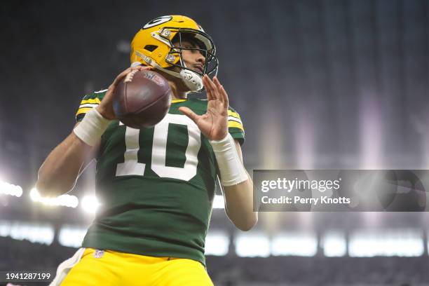 Jordan Love of the Green Bay Packers warms up prior to an NFL wild-card playoff football game against the Dallas Cowboys at AT&T Stadium on January...