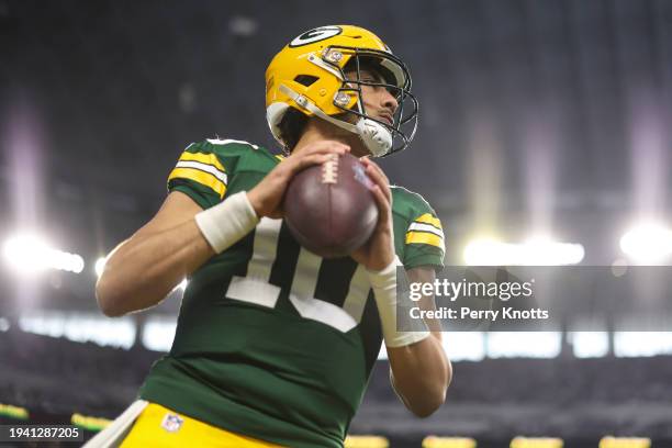 Jordan Love of the Green Bay Packers warms up prior to an NFL wild-card playoff football game against the Dallas Cowboys at AT&T Stadium on January...