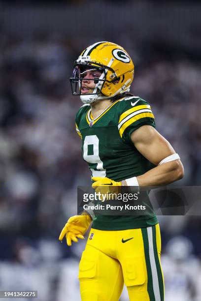 Christian Watson of the Green Bay Packers runs across the field during an NFL wild-card playoff football game against the Dallas Cowboys at AT&T...