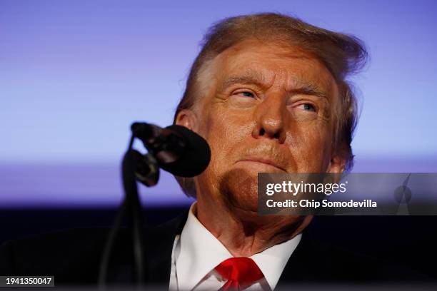 Republican presidential candidate and former U.S. President Donald Trump talks to supporters during a campaign rally at the Sheraton Portsmouth...