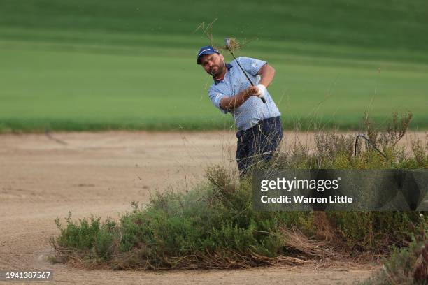 Romain Langasque of France plays his second shot on the 10th hole during Round One of the Hero Dubai Desert Classic at Emirates Golf Club on January...