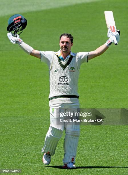 Travis Head of Australia celebrates bringing up his century during day two of the First Test in the Mens Test match series between Australia and West...