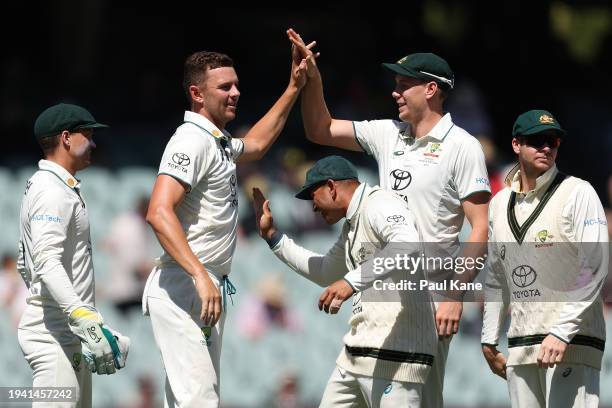 Josh Hazlewood of Australia celebrates the wicket of Tagenarine Chanderpaul of the West Indies during day two of the First Test in the Mens Test...